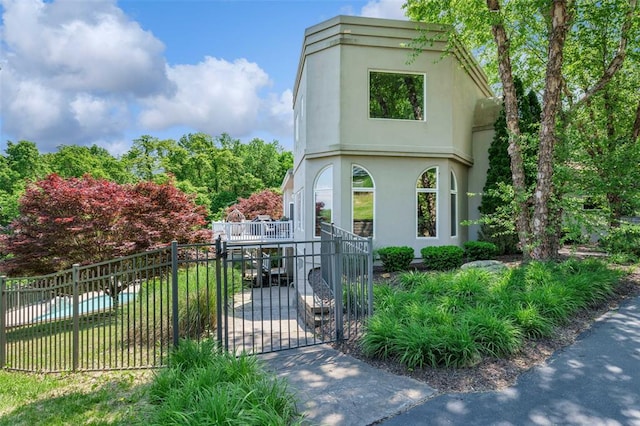 169 Fick Farm Rd, Chesterfield, MO 63005 - view of front of house with stucco siding and a gate