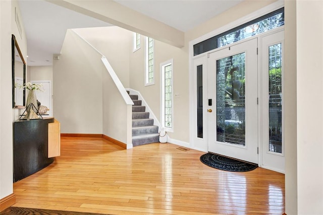 169 Fick Farm Rd, Chesterfield, MO 63005 - entrance foyer with stairway, hardwood / wood-style flooring, and baseboards
