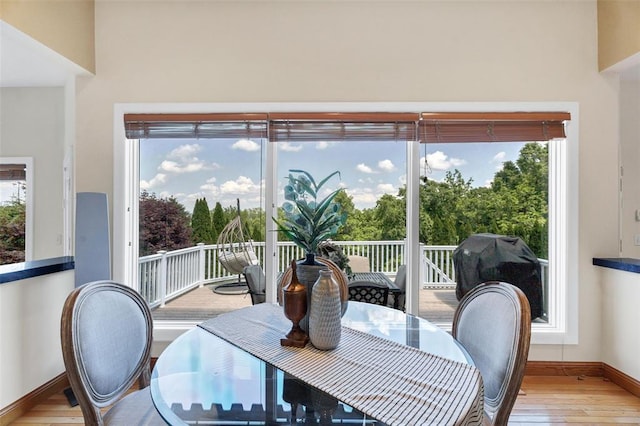 169 Fick Farm Rd, Chesterfield, MO 63005 - dining area featuring hardwood / wood-style flooring, baseboards, and healthy amount of natural light