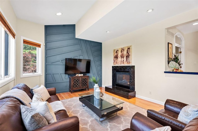 169 Fick Farm Rd, Chesterfield, MO 63005 - living area with wood finished floors, a premium fireplace, baseboards, and recessed lighting