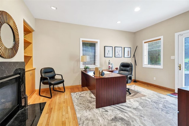 169 Fick Farm Rd, Chesterfield, MO 63005 - office featuring a high end fireplace, light wood-style floors, baseboards, and recessed lighting