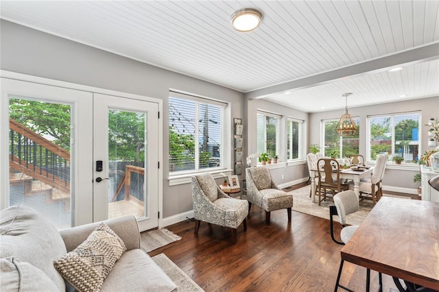 sunroom featuring plenty of natural light, french doors, and beamed ceiling