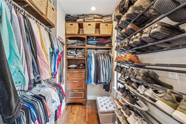 walk in closet featuring wood finished floors