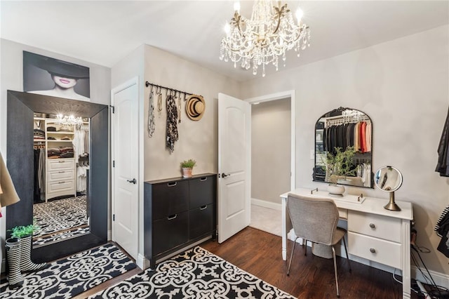 home office with a chandelier, dark wood-style flooring, and baseboards