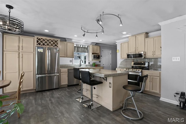 12036 Orchard View Dr, Creve Coeur Township, MO 63146 - kitchen featuring stainless steel appliances, ornamental molding, dark wood finished floors, a breakfast bar area, and cream cabinetry