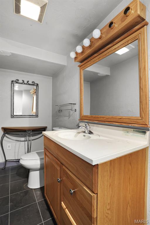 12036 Orchard View Dr, Creve Coeur Township, MO 63146 - bathroom featuring tile patterned floors and vanity