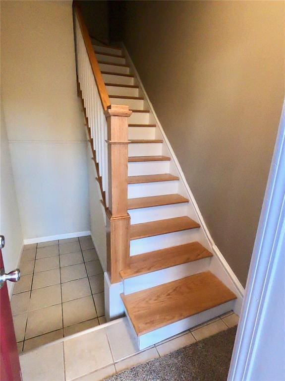3606 Iowa Ave, Saint Louis, MO 63118 - staircase with tile patterned flooring and baseboards
