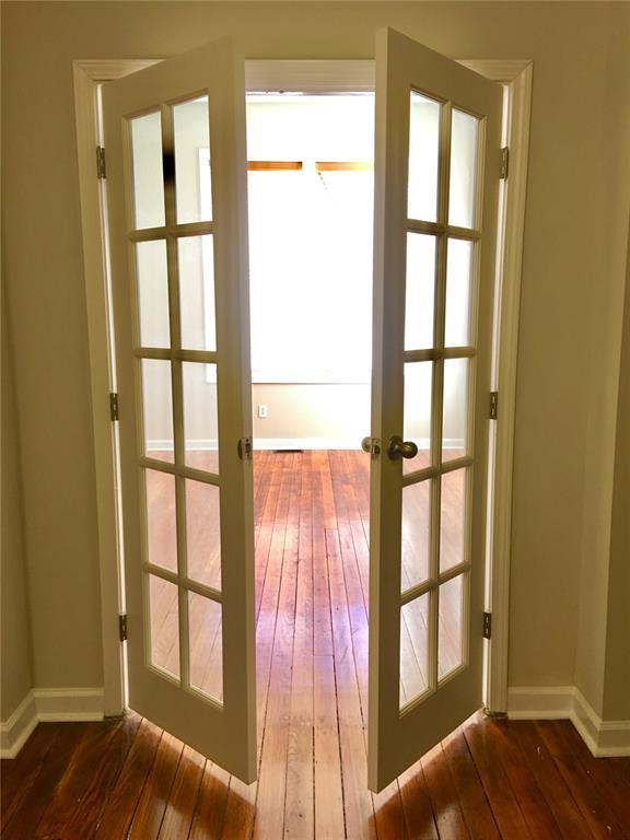 3606 Iowa Ave, Saint Louis, MO 63118 - doorway to outside featuring french doors, hardwood / wood-style flooring, baseboards, and plenty of natural light