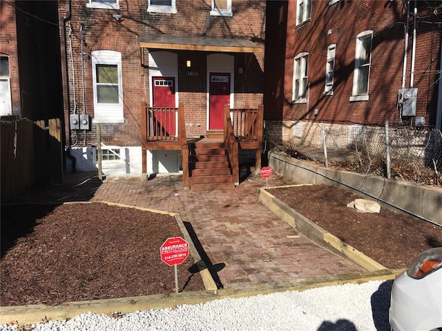 3606 Iowa Ave, Saint Louis, MO 63118 - view of exterior entry featuring brick siding and fence