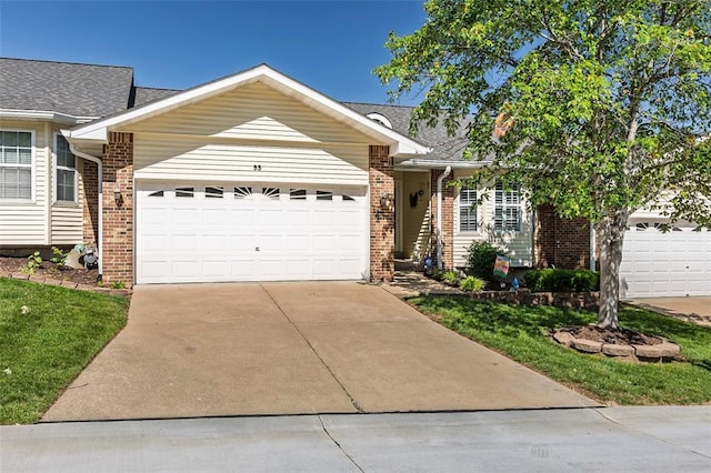 55 Rue De Paix Dr, Lake St Louis, MO 63367 - ranch-style home with an attached garage, concrete driveway, brick siding, and a shingled roof