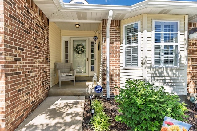 55 Rue De Paix Dr, Lake St Louis, MO 63367 - entrance to property with a porch and brick siding