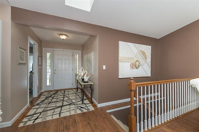 55 Rue De Paix Dr, Lake St Louis, MO 63367 - entryway featuring baseboards, wood finished floors, and a skylight