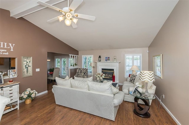55 Rue De Paix Dr, Lake St Louis, MO 63367 - living area with baseboards, high vaulted ceiling, dark wood finished floors, a glass covered fireplace, and beamed ceiling