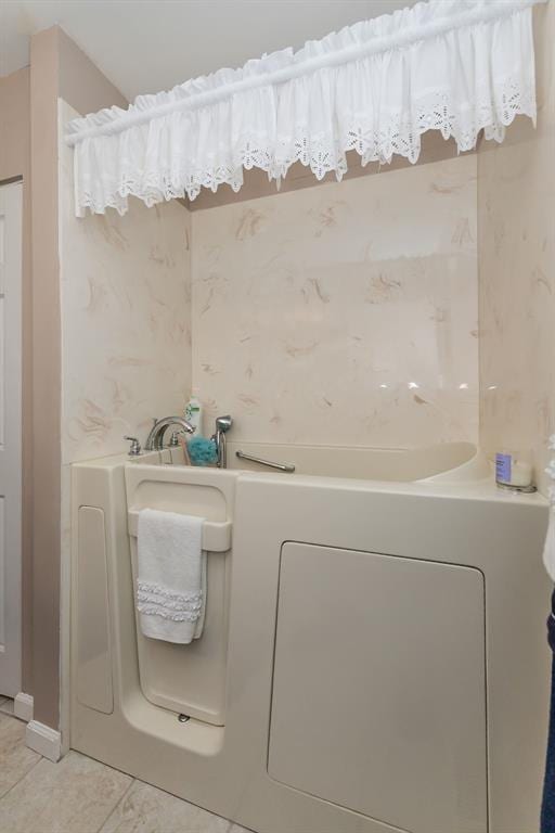 55 Rue De Paix Dr, Lake St Louis, MO 63367 - bathroom featuring tile patterned flooring and washer / clothes dryer
