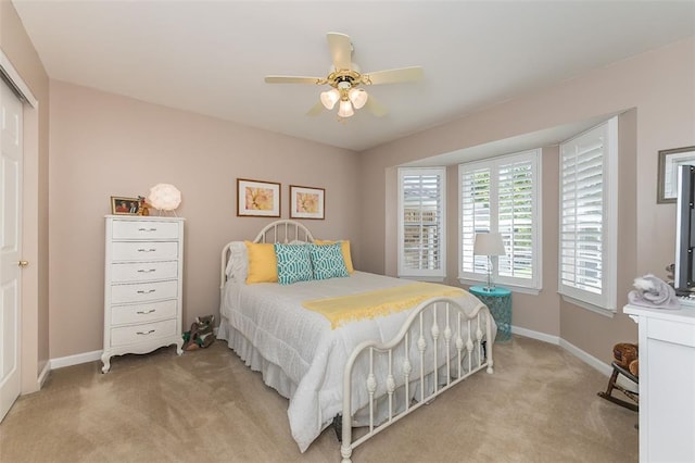 55 Rue De Paix Dr, Lake St Louis, MO 63367 - bedroom with light carpet, baseboards, a closet, and a ceiling fan