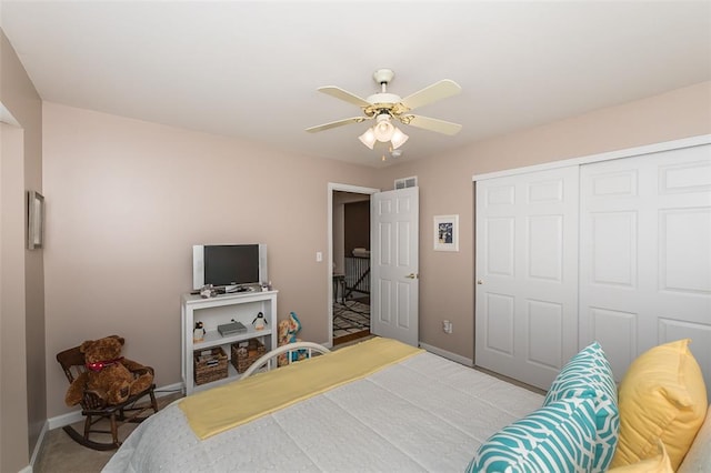 55 Rue De Paix Dr, Lake St Louis, MO 63367 - bedroom featuring a closet, baseboards, a ceiling fan, and carpet