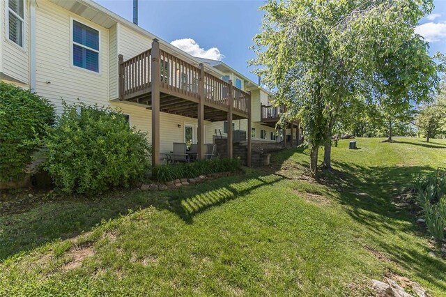 55 Rue De Paix Dr, Lake St Louis, MO 63367 - view of grassy yard featuring a wooden deck
