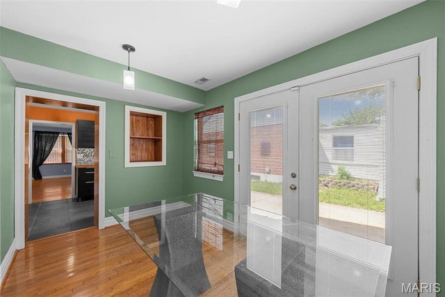 8261 Watson Rd, Saint Louis, MO 63119 - dining area with french doors and light wood-style floors