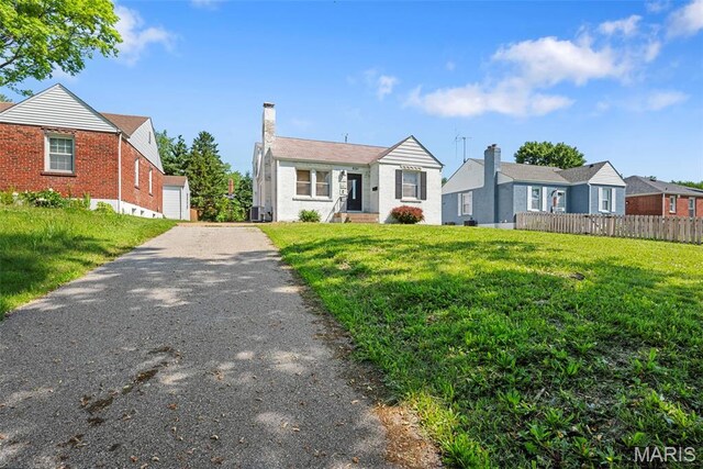8261 Watson Rd, Saint Louis, MO 63119 - view of front of house with a chimney and brick siding