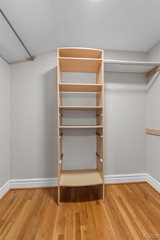 8261 Watson Rd, Saint Louis, MO 63119 - walk in closet featuring wood finished floors