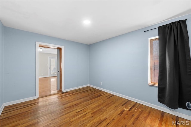 8261 Watson Rd, Saint Louis, MO 63119 - spare room featuring wood-type flooring and recessed lighting