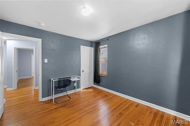 8261 Watson Rd, Saint Louis, MO 63119 - spare room with wood finished floors and a smoke detector