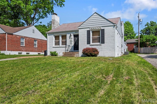 8261 Watson Rd, Saint Louis, MO 63119 - view of front of home featuring a chimney and brick siding