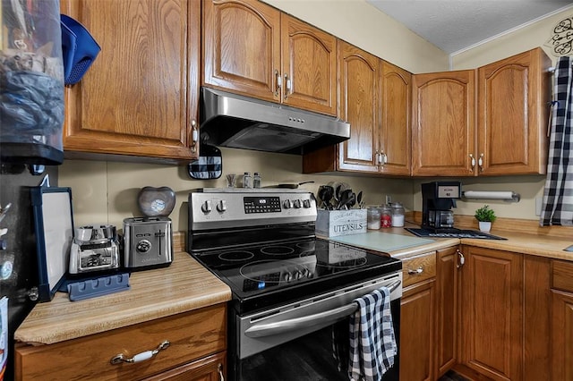24864 Bcr 326, Marble Hill, MO 63764 - kitchen featuring stainless steel electric range, under cabinet range hood, brown cabinetry, and light countertops