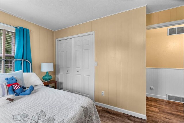 24864 Bcr 326, Marble Hill, MO 63764 - bedroom with wood finished floors, baseboards, a closet, crown molding, and wooden walls
