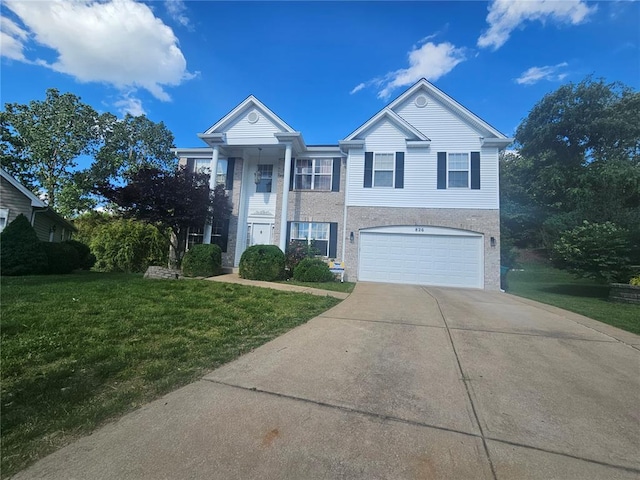 826 Oak Mill Ln, Imperial, MO 63052 - greek revival house with concrete driveway, a front lawn, and an attached garage