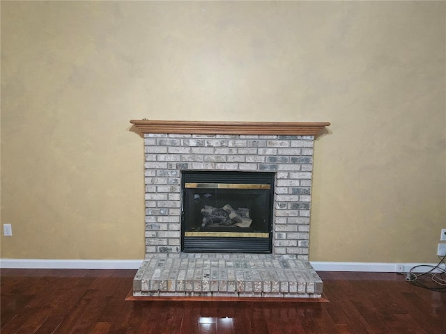 826 Oak Mill Ln, Imperial, MO 63052 - detailed view of wood finished floors, a fireplace, and baseboards