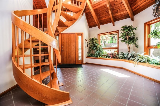 entryway featuring wood ceiling, stairway, baseboards, and tile patterned floors