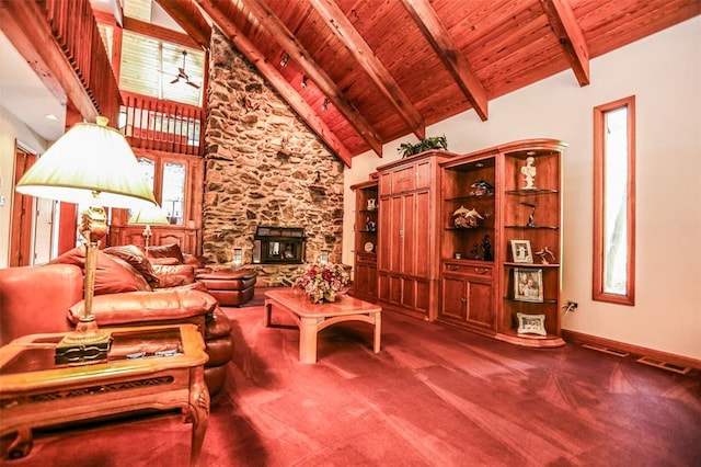 carpeted living room featuring wooden ceiling, high vaulted ceiling, beamed ceiling, baseboards, and a stone fireplace