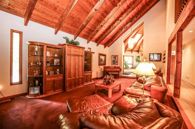 living area featuring wooden ceiling, high vaulted ceiling, beamed ceiling, healthy amount of natural light, and baseboards