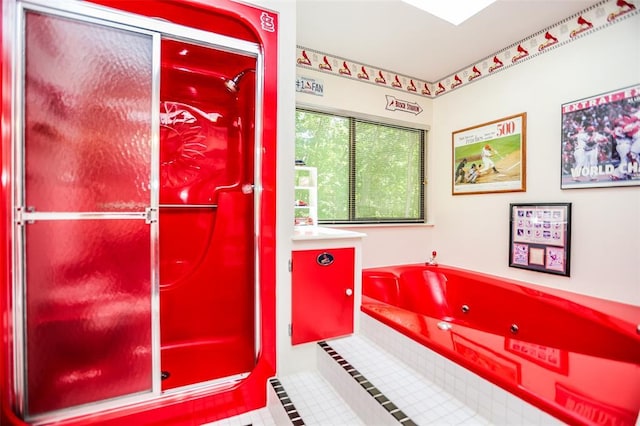bathroom featuring a garden tub and a shower