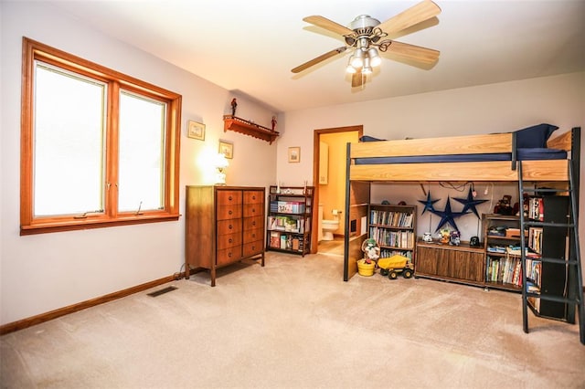 carpeted bedroom featuring baseboards