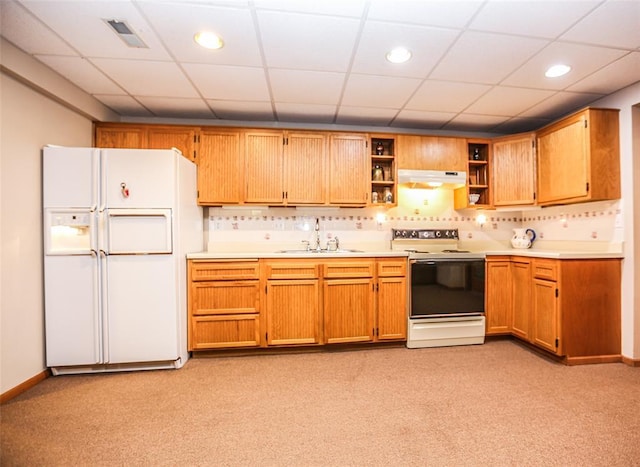 kitchen with white appliances, a sink, under cabinet range hood, open shelves, and light countertops