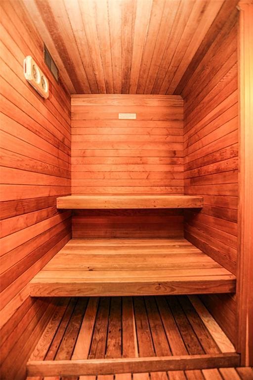 relaxing sauna / steam room with wooden walls and wooden ceiling