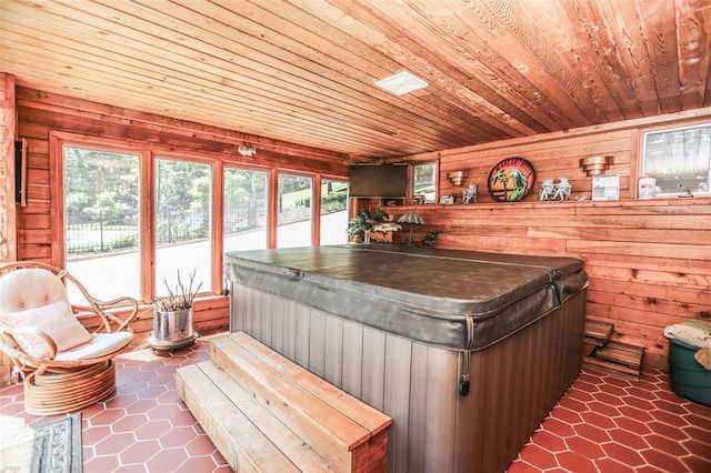 misc room featuring wooden ceiling, wood walls, and dark tile patterned floors