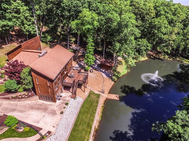 aerial view of property and surrounding area featuring a large body of water