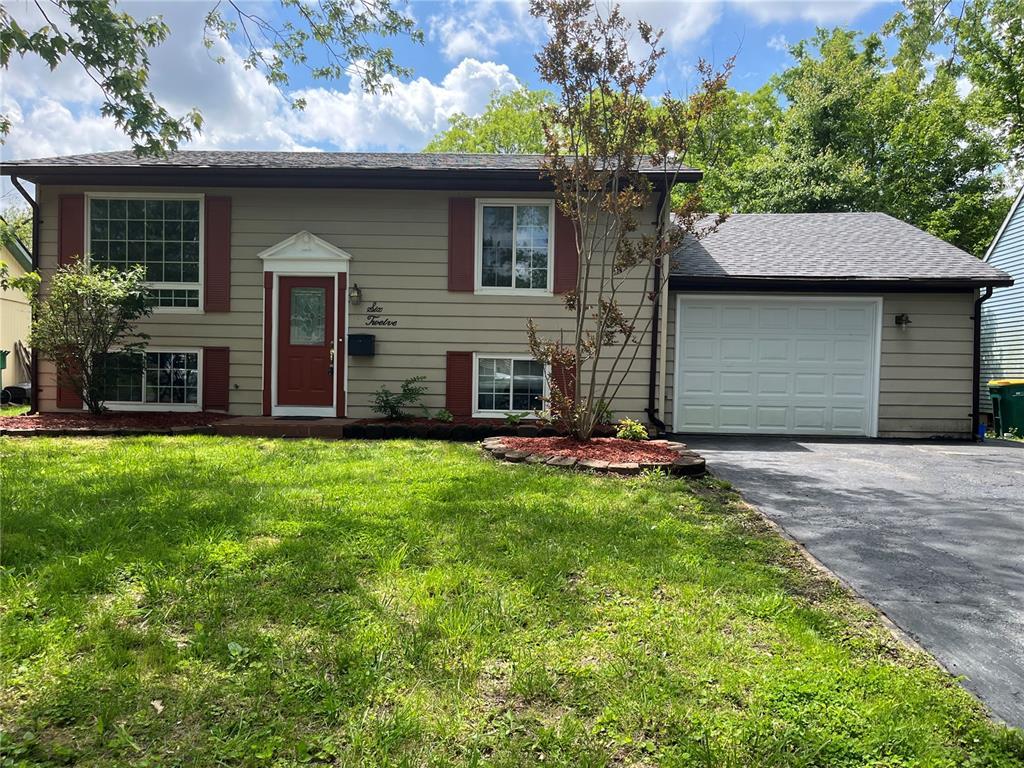 612 Linden Ct, Ofallon, IL 62269 - raised ranch with driveway, a garage, and a front yard
