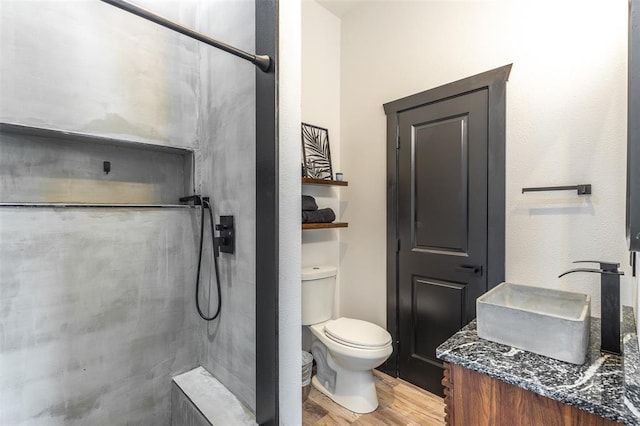 1300 River Valley Rd, Doniphan, MO 63935 - full bathroom featuring wood finished floors, toilet, a tile shower, and vanity