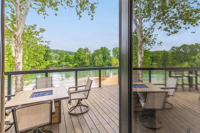 1300 River Valley Rd, Doniphan, MO 63935 - wooden terrace with a fire pit and a wooded view