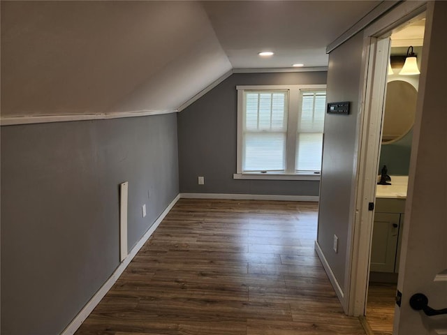 129 N Pence St, East Alton, IL 62024 - bonus room with lofted ceiling, dark wood finished floors, baseboards, and recessed lighting