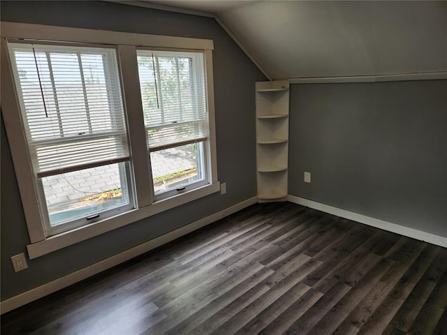 129 N Pence St, East Alton, IL 62024 - bonus room with lofted ceiling, baseboards, and dark wood-style floors