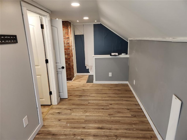 129 N Pence St, East Alton, IL 62024 - additional living space with wood finished floors, lofted ceiling, recessed lighting, and baseboards