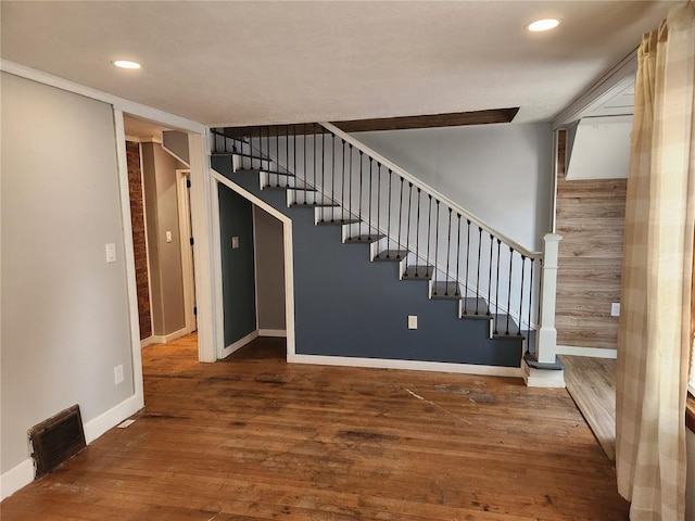 129 N Pence St, East Alton, IL 62024 - staircase with baseboards, wood finished floors, and recessed lighting