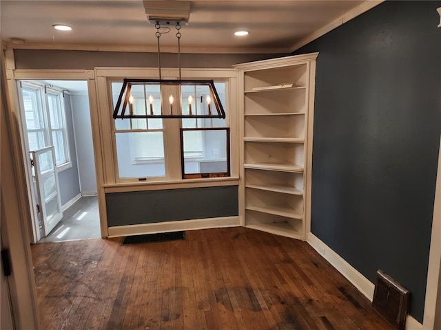 129 N Pence St, East Alton, IL 62024 - unfurnished dining area with baseboards, dark wood-type flooring, ornamental molding, and recessed lighting