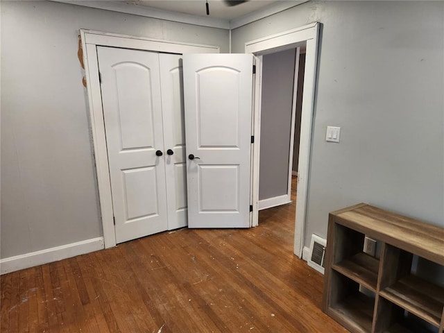 129 N Pence St, East Alton, IL 62024 - corridor with wood-type flooring and baseboards