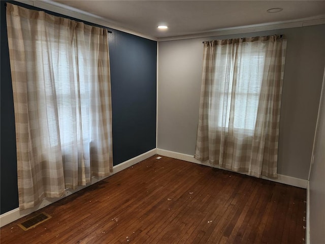 129 N Pence St, East Alton, IL 62024 - empty room with dark wood-style flooring, baseboards, and crown molding